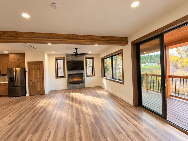 Living room with large windows and doors to the covered outdoor area