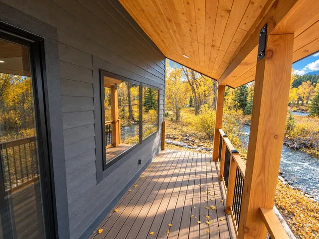 Covered wooden porch looking toward the river
